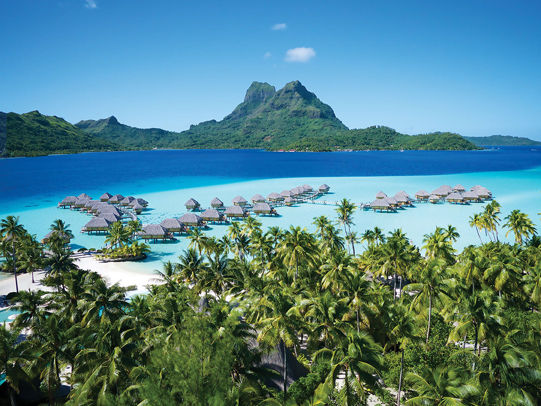 A view of the overwater bungalows at the Bora Bora Pearl Beach Resort, with Mount Otemanu in the background.